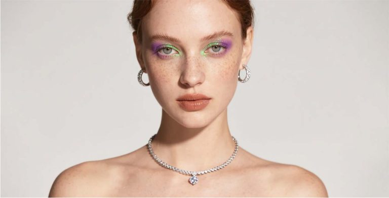 Woman wearing a shiny silver necklace after cleaning